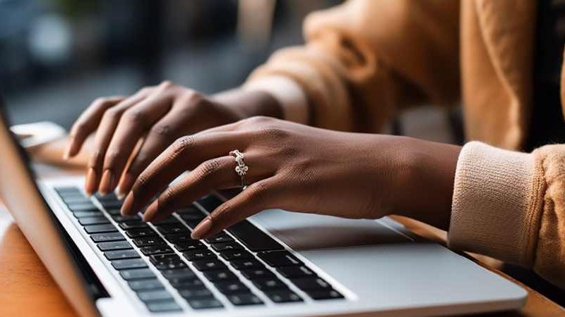 Woman typing on a laptop
